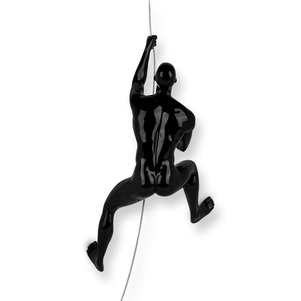 Bergsteiger Skulptur aus lackiertem Kunstharz - Rückansicht eines Bergsteigers, der in einem dynamischen Klettermoment abgebildet ist.