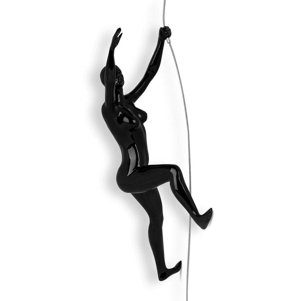 Bergsteigerin 2 schwarz lackiert. Moderne figurative Skulptur aus lackiertem Kunstharz, zum Aufhängen an die Wand - Designerobjekte.com