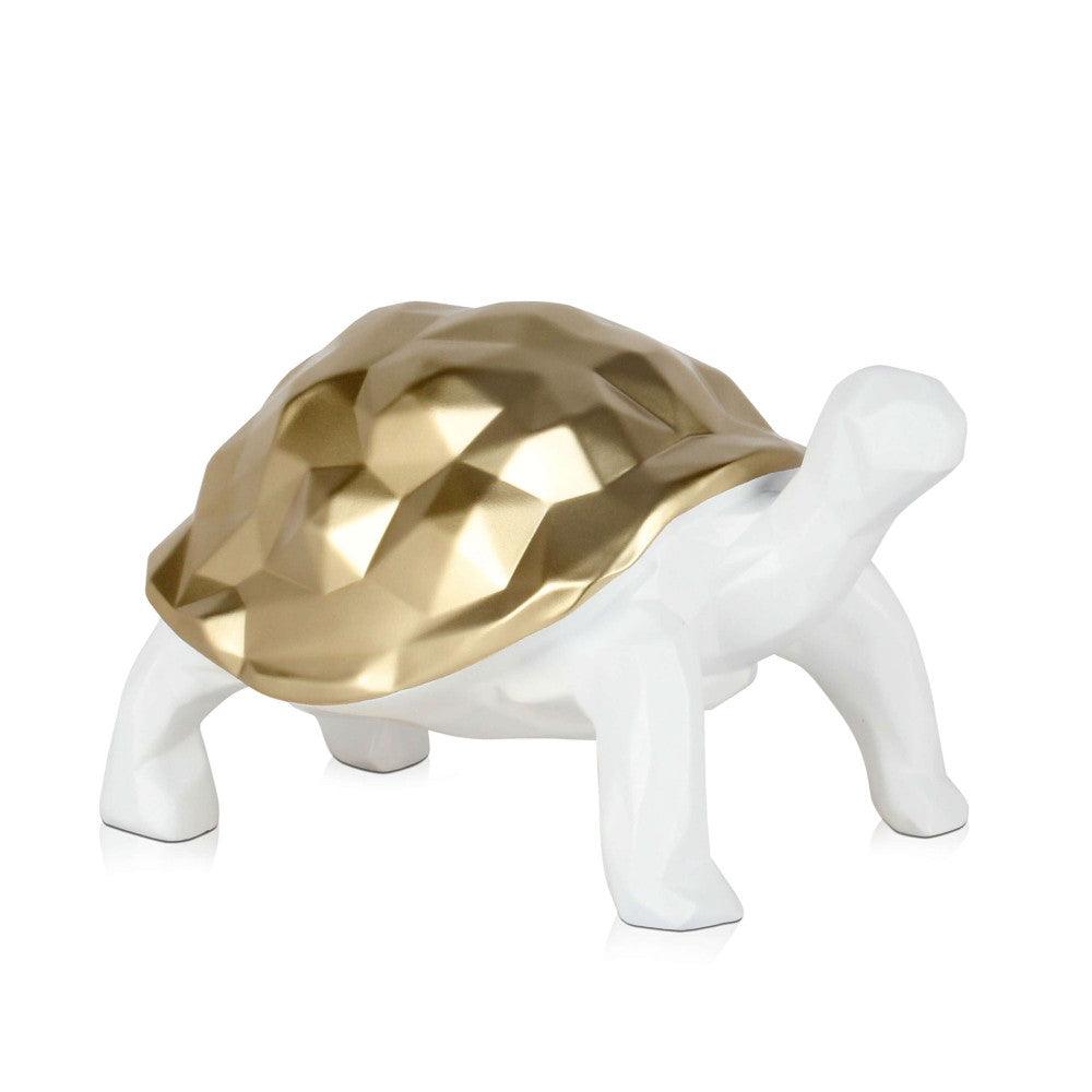 Facettierte goldene Schildkröte - Moderne Harzskulptur mit Metalleffekt, stilvolle Dekofigur mit einem einzigartigen, geformten goldenen Panzer auf einem weißen Körper.