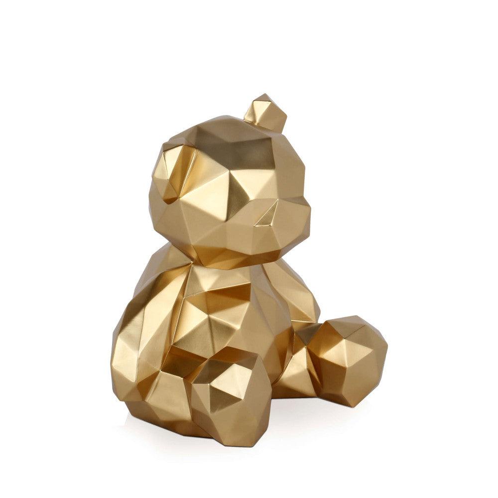 Faszination der facettierten Bärchen-Skulptur aus hochwertigem Harz mit Metalleffekt, sitzend und in einem eleganten Raum platziert.