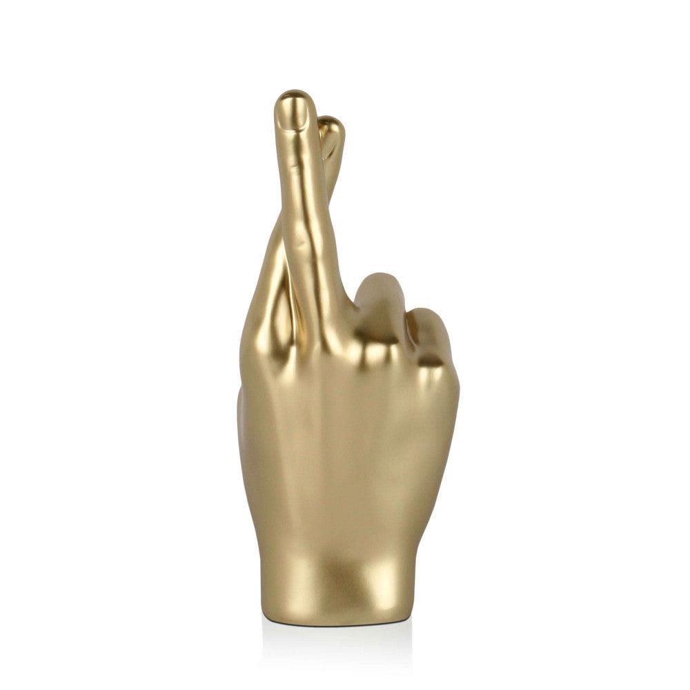 Gekreuzte Finger Skulptur in Gold - ein exklusives Kunstwerk für moderne Wohnräume.