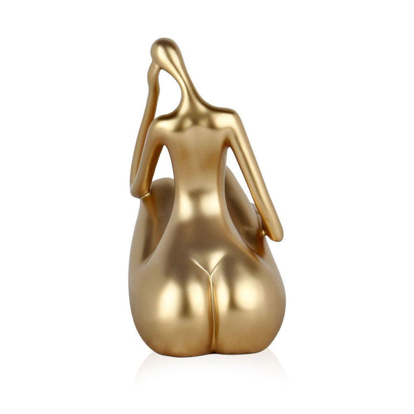 Kleine Reflexion, gold. Moderne figurative Skulptur aus Kunstharz, Metalleffekt. 26,5 x 27 x 13 cm - Designerobjekte.com