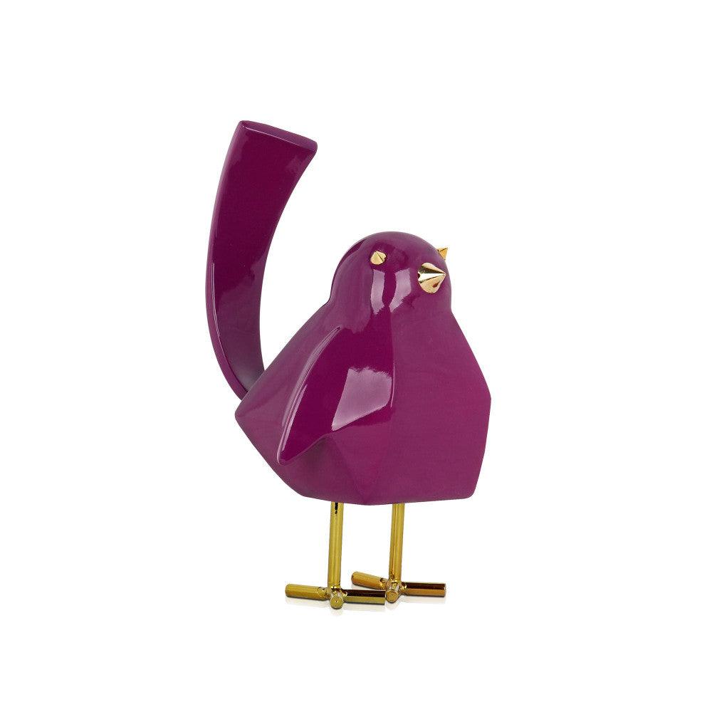Moderne geometrische Vogel-Skulptur aus lilafarbenem Kunstharz mit goldenen Metalleinsätzen, die auf kunstvollen Beinen steht und ideal als Dekoration in verschiedenen Räumen dient.