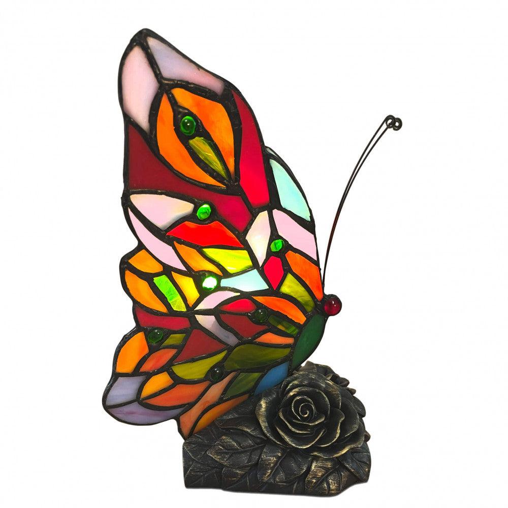 Tiffany Nachttischlampe im Schmetterlingsdesign mit bronziertem Kunstharzfuß, seitliche Ansicht mit buntem Glasschirm und Rosendetail.