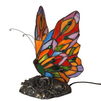 Tiffany Nachttischlampe im Schmetterlingsdesign, Rückansicht zeigt das kunstvolle Schmetterlingsmotiv aus buntem Glas und den stabilen Kunstharzfuß.