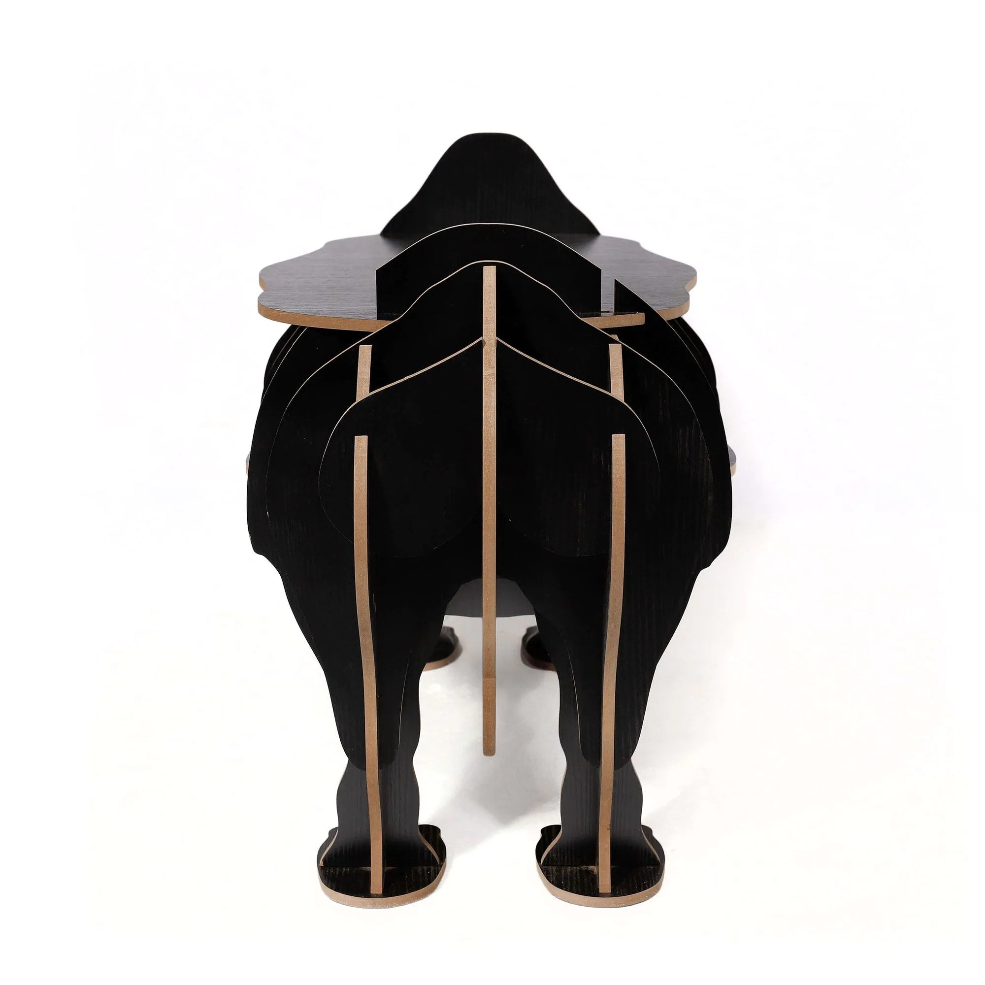 Büchertisch Schwarzes Nashorn - modernes Design mit einer Kombination aus Funktionalität und Kunst, ideal als Akzentmöbel.