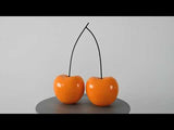 Doppelkirschen orange. Skulptur Pop Art aus lackiertem Harz