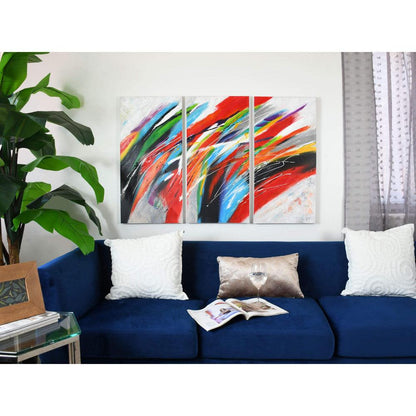 Faszinierendes mehrfarbiges Wellen-Gemälde auf Leinwand - Handgemalt, 80 x 120 cm. Das Gemälde präsentiert sich eindrucksvoll über einem blauen Sofa in einem modernen Wohnraum.