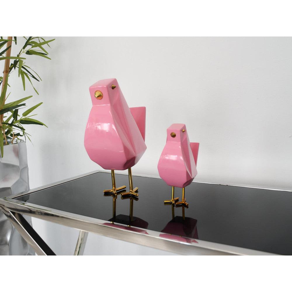 Zwei moderne geometrische Skulpturen 'Vöglein rosa' aus lackiertem Harz, eine größere und eine kleinere Figur, elegant auf einem Tisch angeordnet, ideal für die Inneneinrichtung und Kunstliebhaber.
