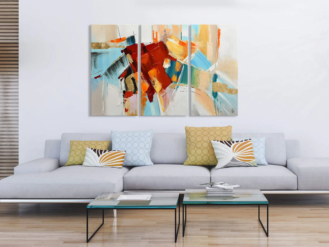 Stylisches modernes Wandgemälde 100x150 cm, präsentiert über einem eleganten Sofa. Das abstrakte mehrfarbige Design verleiht dem Raum eine zeitgenössische Note.